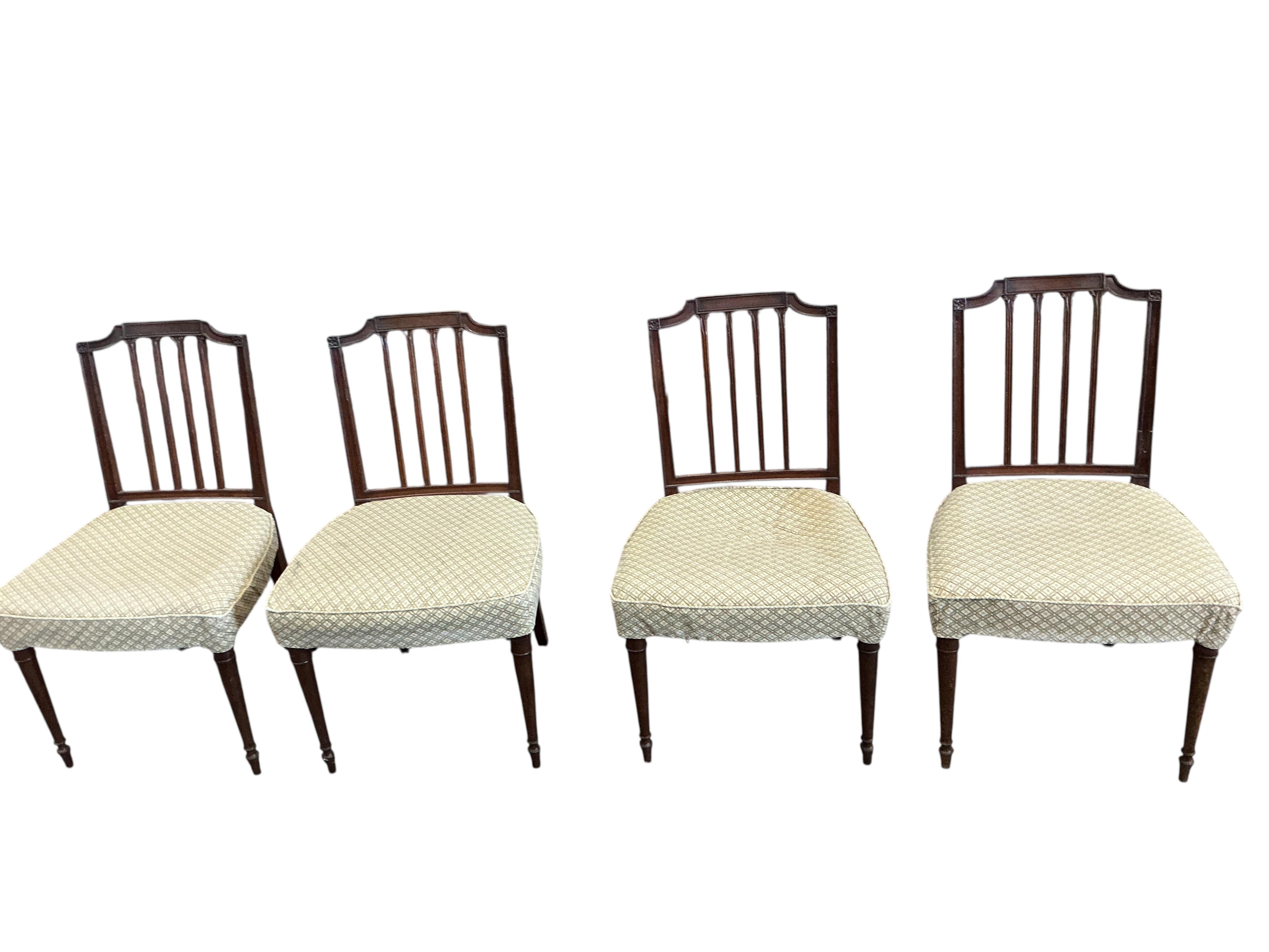 A harlequin set of eight George III Sheraton style mahogany dining chairs, two with arms